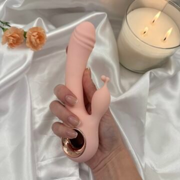 Pink silicone dual rabbit vibrator with golden handle for clitoral and G-spot stimulation