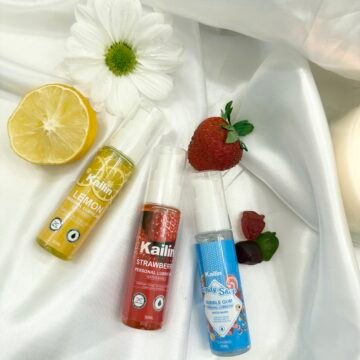 Flavored personal lubricant strawberry lemon bubble gum in bottles with fruit props